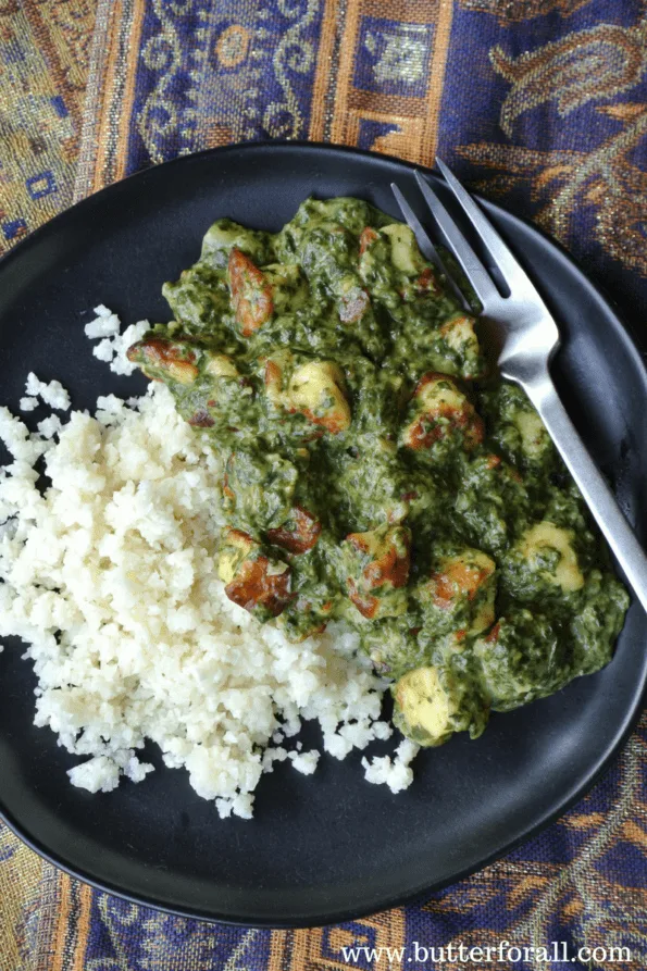 A plate of saag paneer with cauliflower rice.