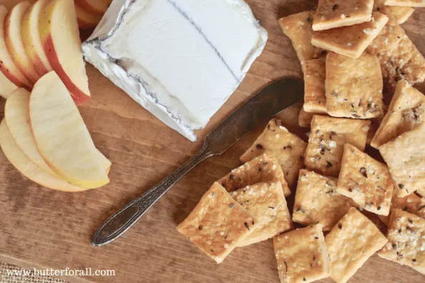 Rustic sourdough butter crackers served with cheese and apple.