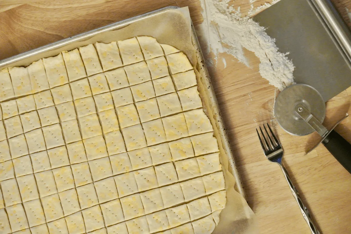 Cutting and docking the dough.