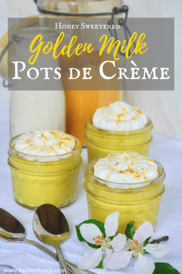 Bright yellow, individual golden milk custards topped with whipped cream.