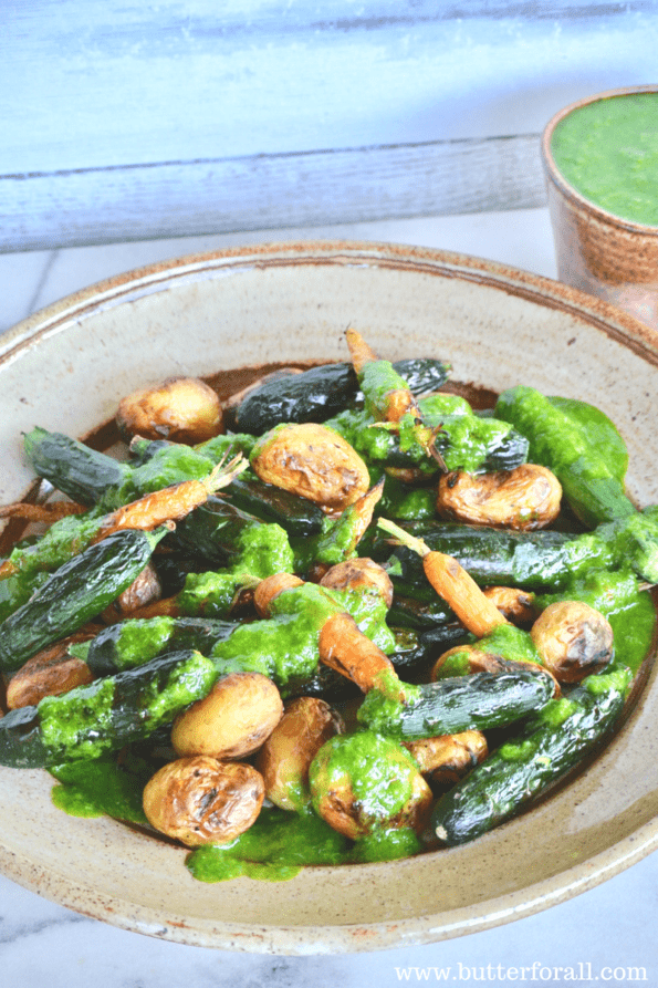 A plate of grilled baby veggies dressed with spicy garlic chive oil.