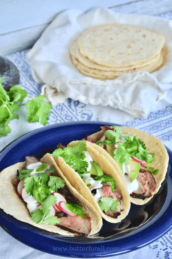 Thick, soft corn tortillas loaded with toppings.