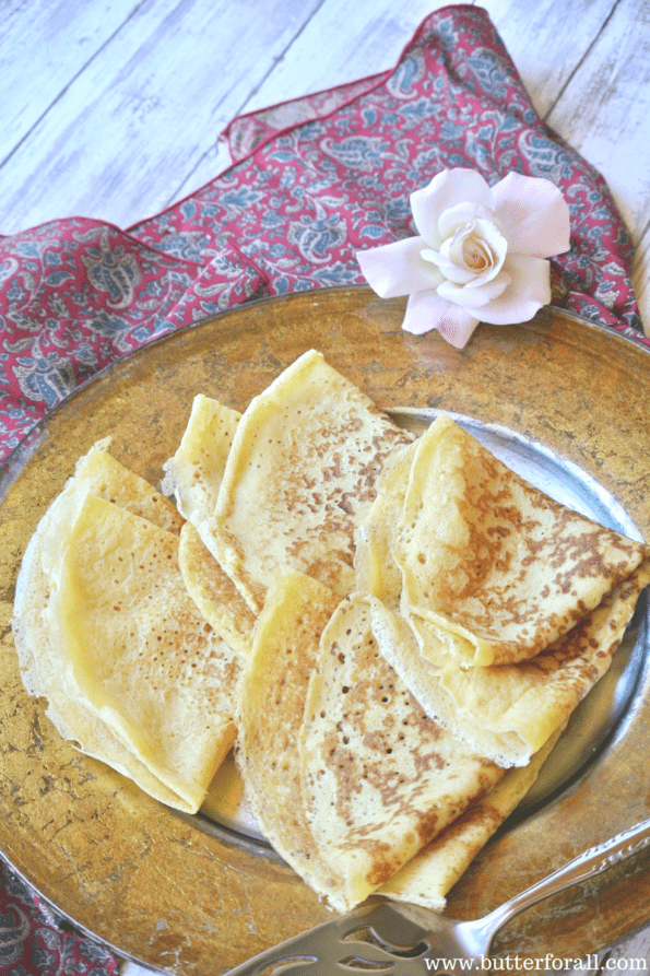 A plate of soft and chewy sourdough crepes.