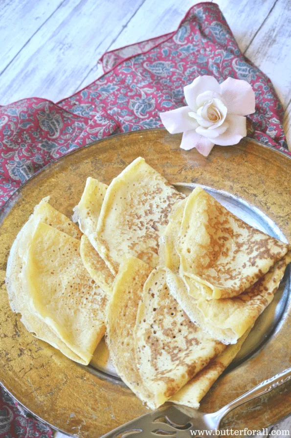 A plate of soft and chewy sourdough crepes.