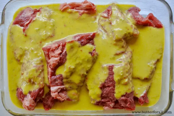 Bavette steaks being marinated in jalapeno peach marinade.