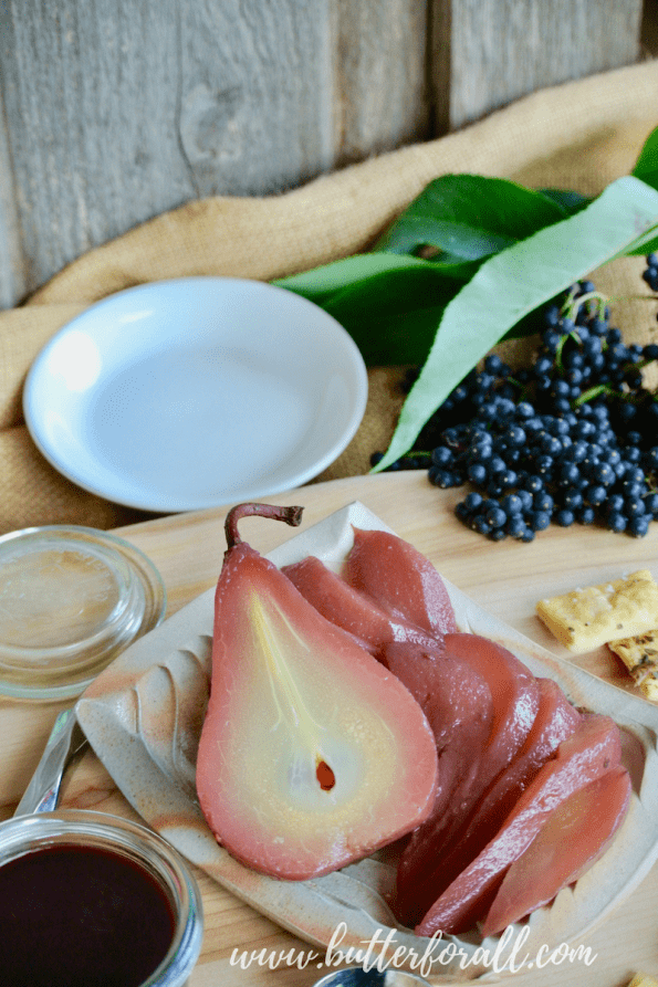 Beautiful elderberry poached pears and elderberry syrup compliment this cheese and meat board.