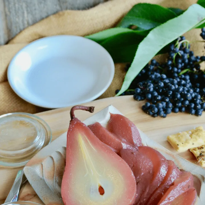 Beautiful elderberry poached pears and elderberry syrup compliment this cheese and meat board.