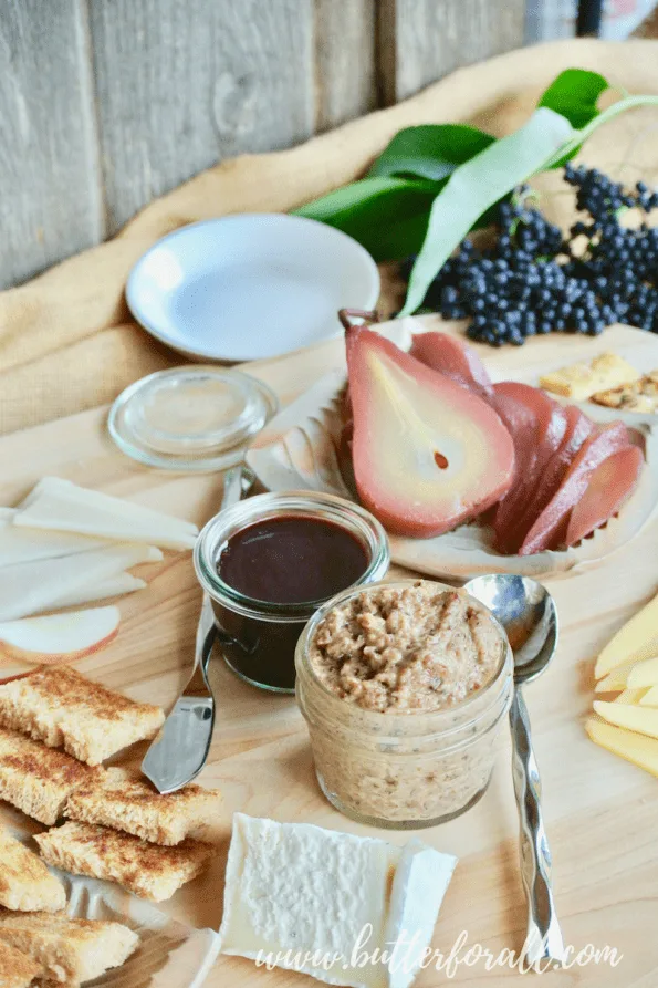 Beautiful elderberry poached pears and elderberry syrup complement this cheese and meat board.