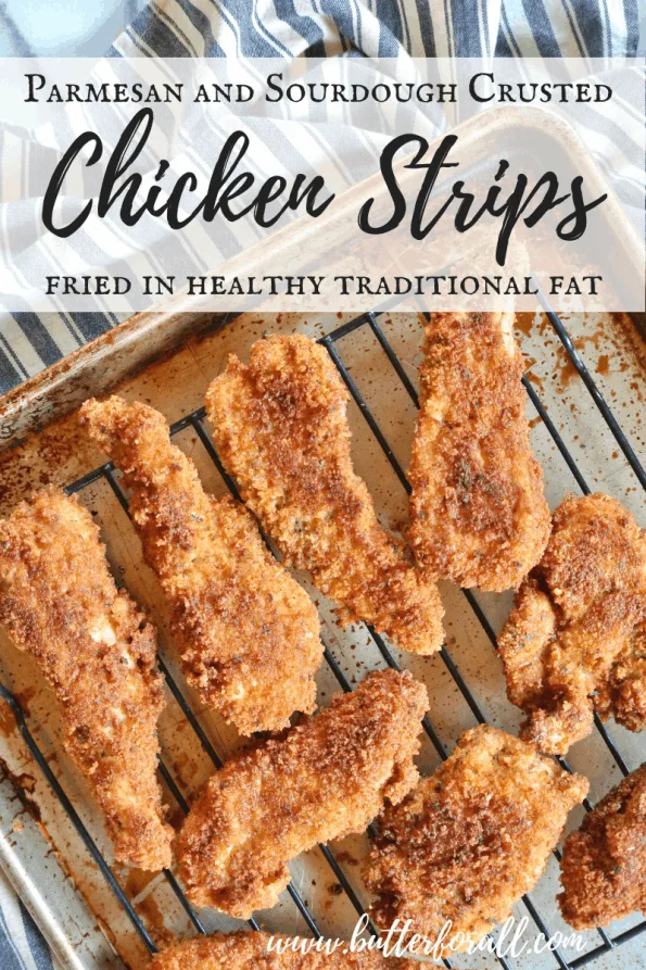 A tray of crispy chicken strips coated in real sourdough bread crumbs and Parmesan cheese with text overlay.