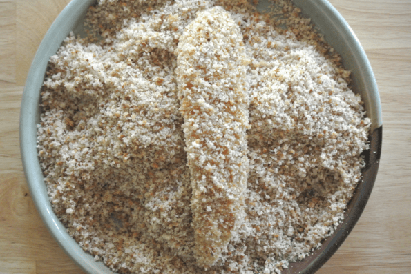 The chicken strips get a final coating of sourdough bread crumbs.