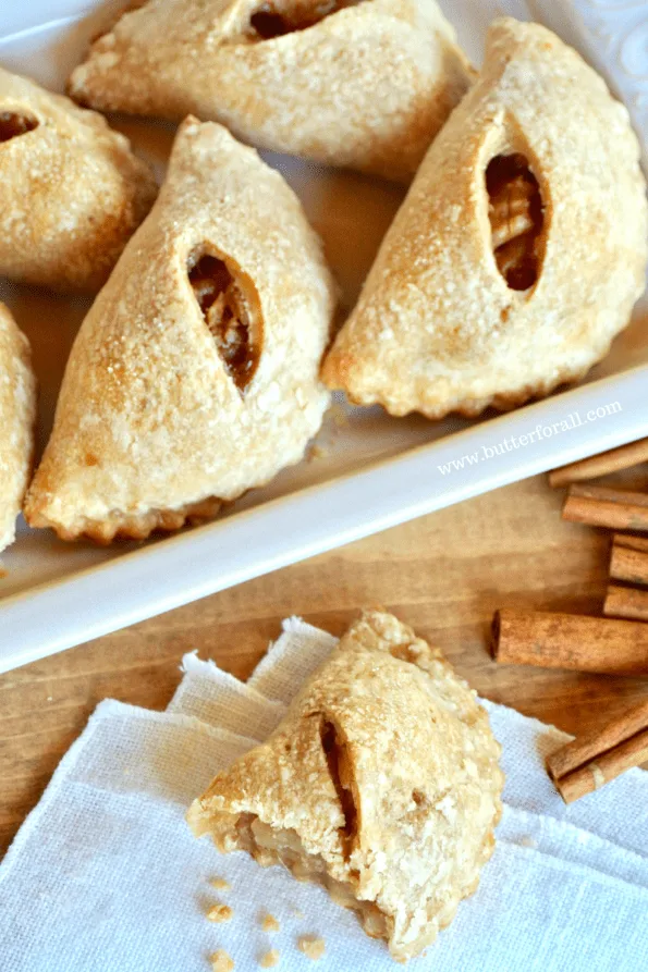 A close-up of baked mini maple apple pies.