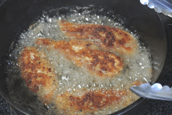 The chicken strips are fried to a golden brown.