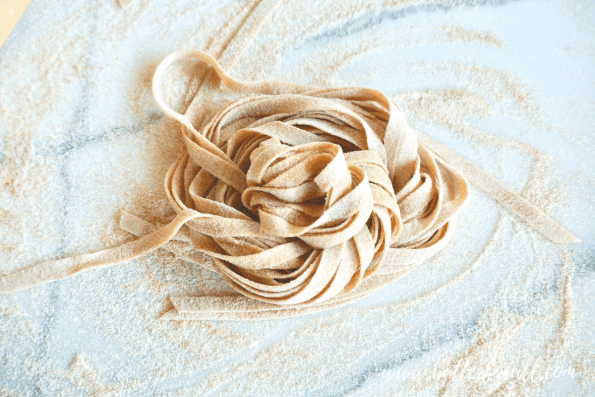 A close-up of uncooked sourdough noodles.