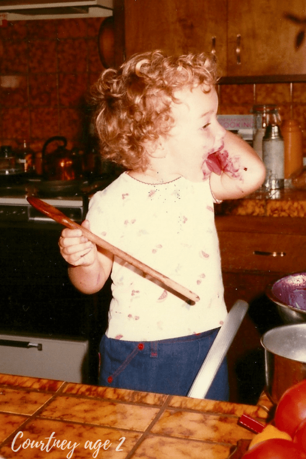 Courtney Queen the Author of Butter For All in the kitchen at age 2!
