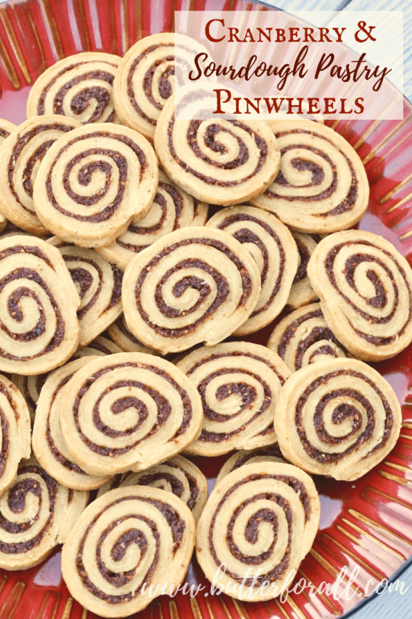 A plate of Cranberry and Sourdough Pastry Pinwheels with text overlay.