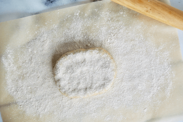 Preparing the sourdough pastry for rolling.