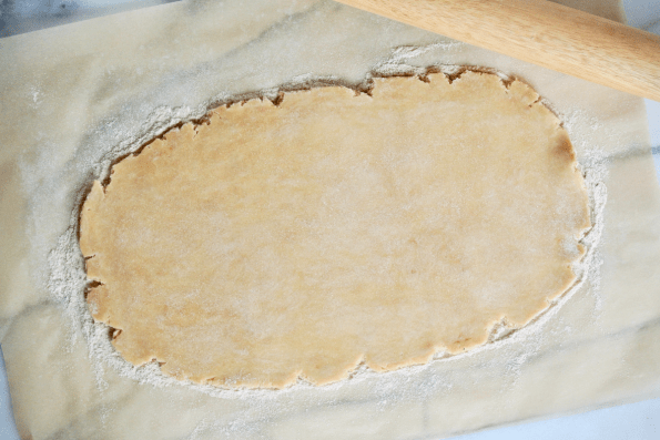 Rolling the sourdough pastry into a rectangle.