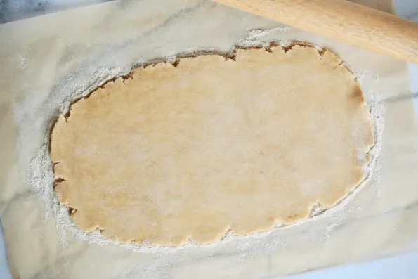 Rolling the sourdough pastry into a rectangle.