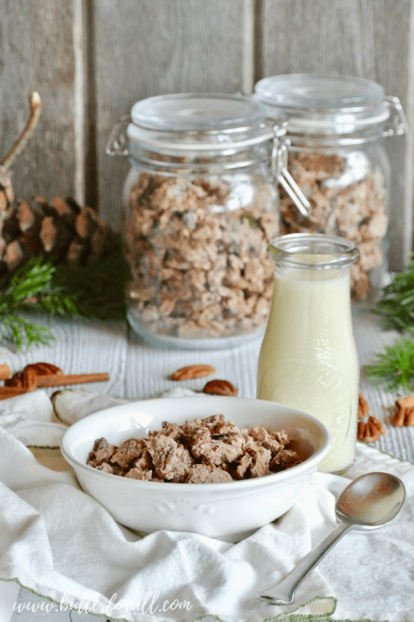 A bowl and two jars of Cinnamon Maple Pecan Granola. 