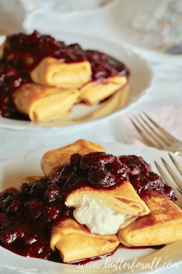 These perfectly butter fried blintzes show the honey sweetened yogurt cheese filling.