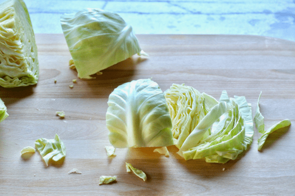 The cabbage is sliced vertically yielding long noodle-like pieces.