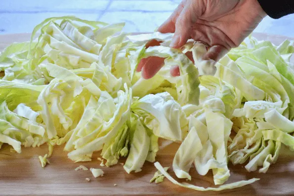 The long strips of cabbage are separated before cooking.