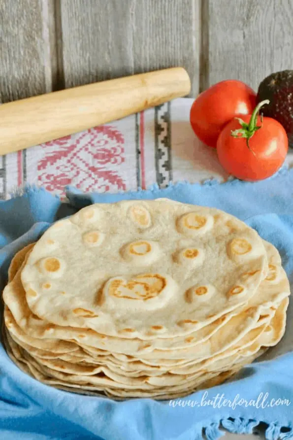 A plate of hot and fresh sourdough tortillas made with real lard and fermentation. #realfood #healthyfat #wisetraditions #nourishingtraditions #authentic #farmtotable #pastured #lard #ethical #fermented #sourdough #starter #tortillas