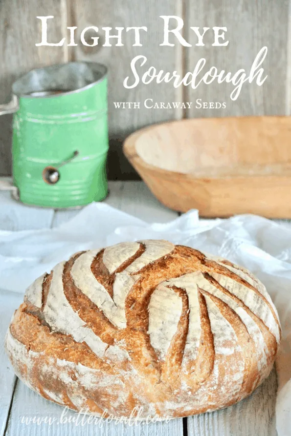 A finished sourdough boule with text overlay.