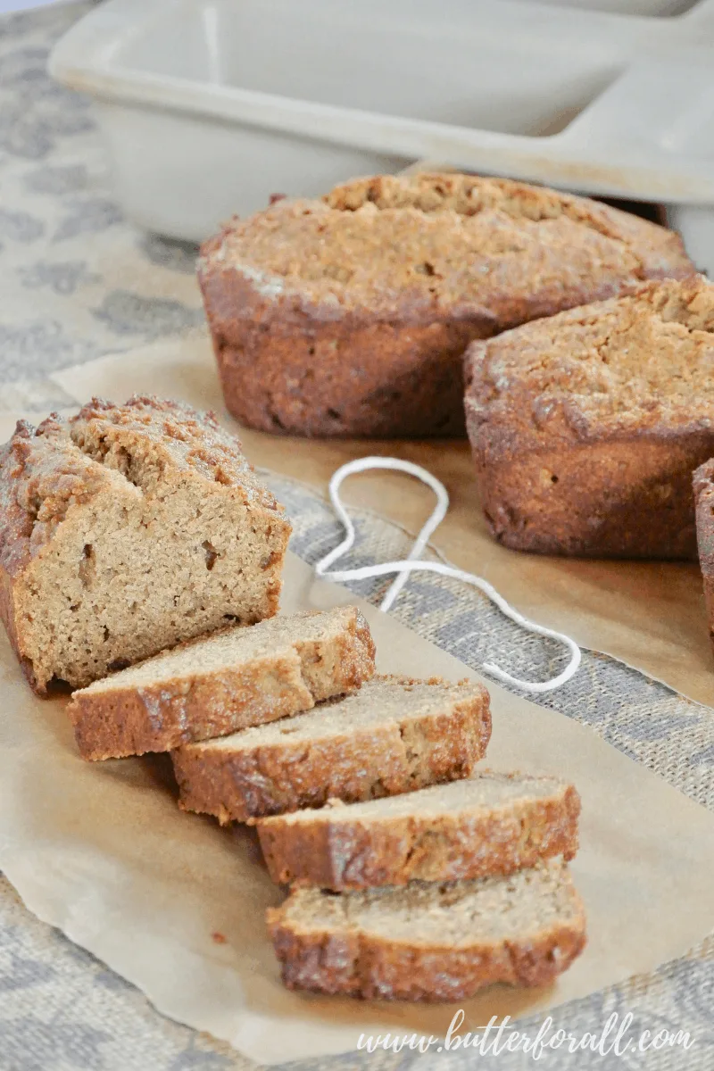 Thick slices of fresh baked sprouted wheat banana bread make a great snack or quick breakfast. Don't for get the real butter! #realfood #sprouted #refinedsugarfree #breakfast #brunch #nutfree #bananabread #easy #fast #wisetraditions #nourishingtraditions