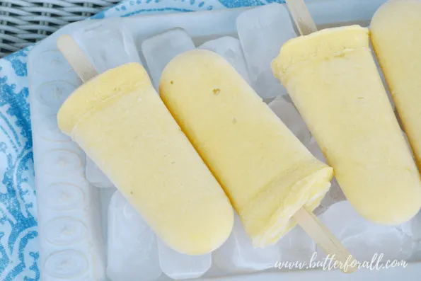 Summer is the season for popsicles. Make them right with probiotic Coconut Yogurt, fresh fruit, and unrefined sweetener! #realfood #fermented #probiotic #mangolassi #dairyfree #coconut #healthyfat #nourishing #wisetraditions #summer #Popsicles #fruit #yogurt