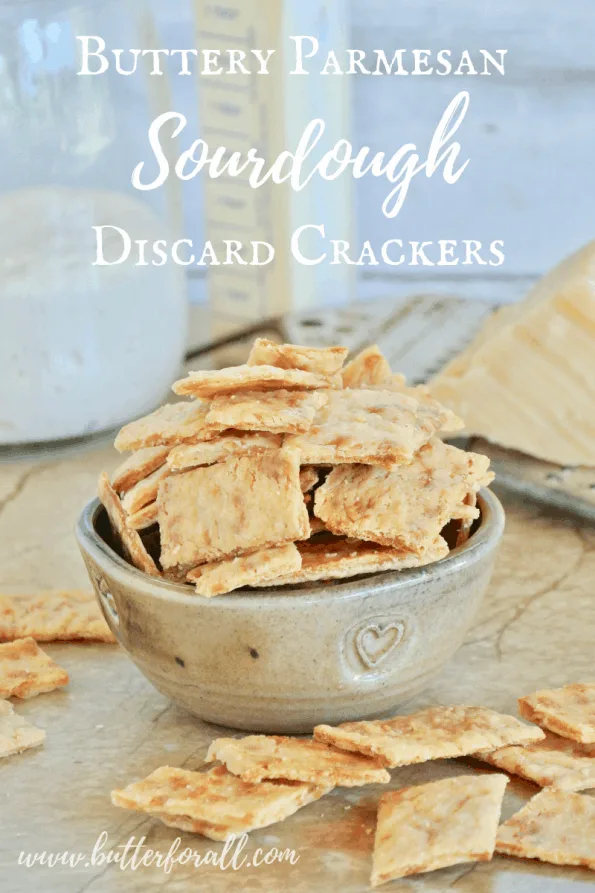 A bowl of the butteriest, flakiest, crunchiest sourdough cheese crackers with text overlay.