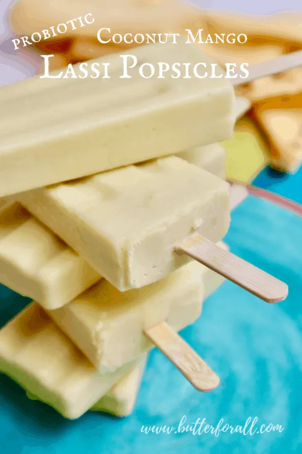 A stack of probiotic coconut mango lassi popsicles with text overlay.