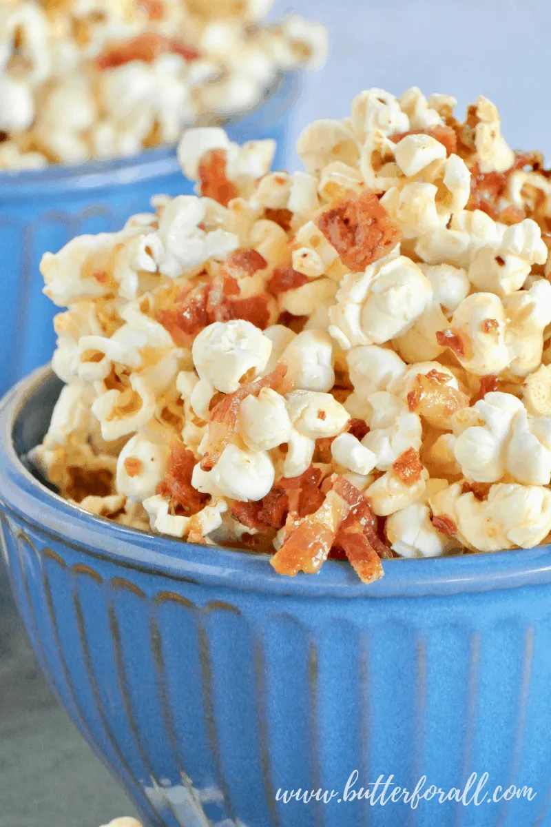 This big bowl of sticky Caramel Corn is made with the classic combination of Maple and Bacon! #realfood #popcorn #coconutoil #bacon #maple #caramel #sweetandsalty #sweetandsavory #baconforlife #healthyfats #moviesnacks