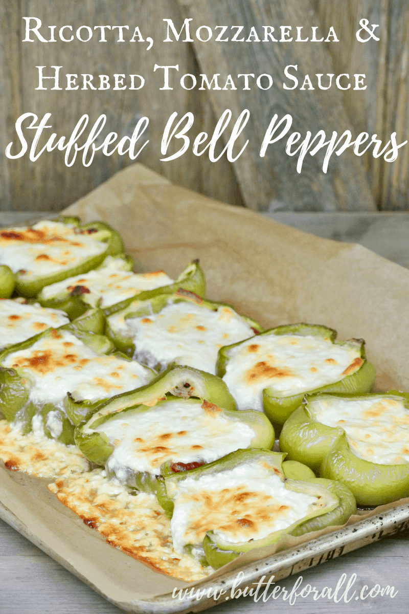 Summer peppers get the royal treatment when they are stuffed with a combination of sweet ricotta cheese, melty mozzarella, and spicy herby tomato sauce and baked to tender creamy perfection! #summer #sidedish #bellpeppers #cheese #realfood #sheetpan #lowcarb #keto