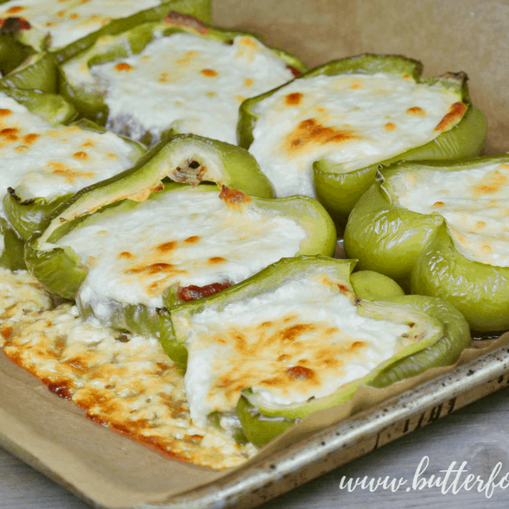 A perfect blend of sweet ricotta and mozzarella cheese melts together in these easy stuffed peppers! #summer #sidedish #bellpeppers #cheese #realfood #sheetpan #lowcarb #keto