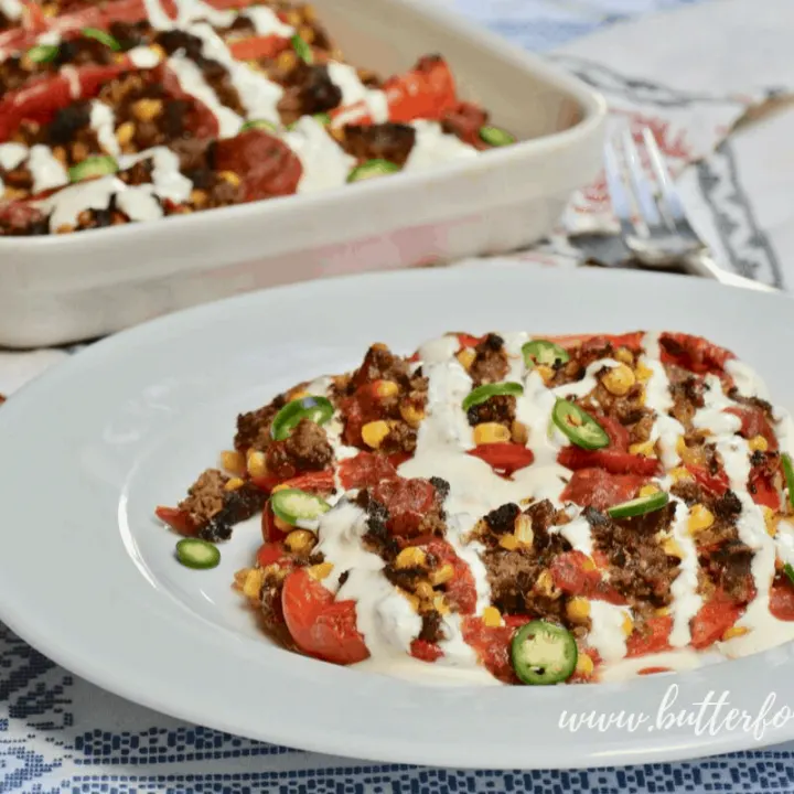 These beautiful stuffed peppers are the perfect way to celebrate the harvest season and all the beautiful late summer, early fall produce. Big juicy peppers are stuffed to the brim with ground beef, fresh sweet corn, tomatillos, chili peppers and melty jack cheese! #grainfree #dinner #harvest #summer #peppers #nourishing #farmtotable #realfood #southwestern #newmexico #wisetraditions