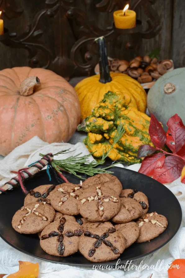 A plate of soft soul cakes with fall table decorations.
