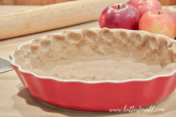 An unbaked pie crust in a pan.