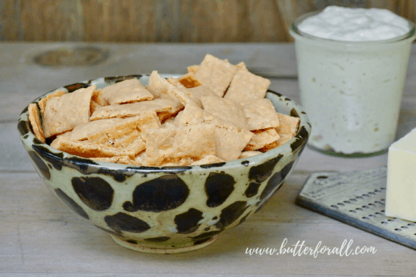 A bowl of cheesy sourdough cheddar crackers.