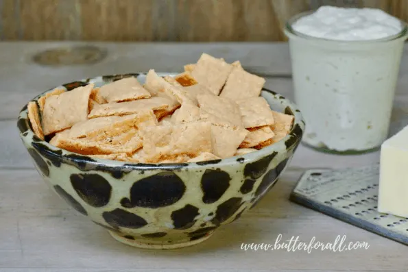 A bowl of cheesy sourdough cheddar crackers.