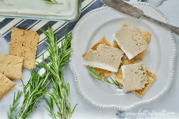 A plate of crackers with beef liver pâté.