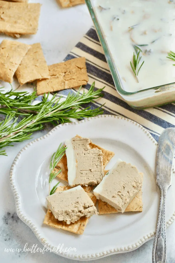 A close-up of beef liver pâté on crackers.