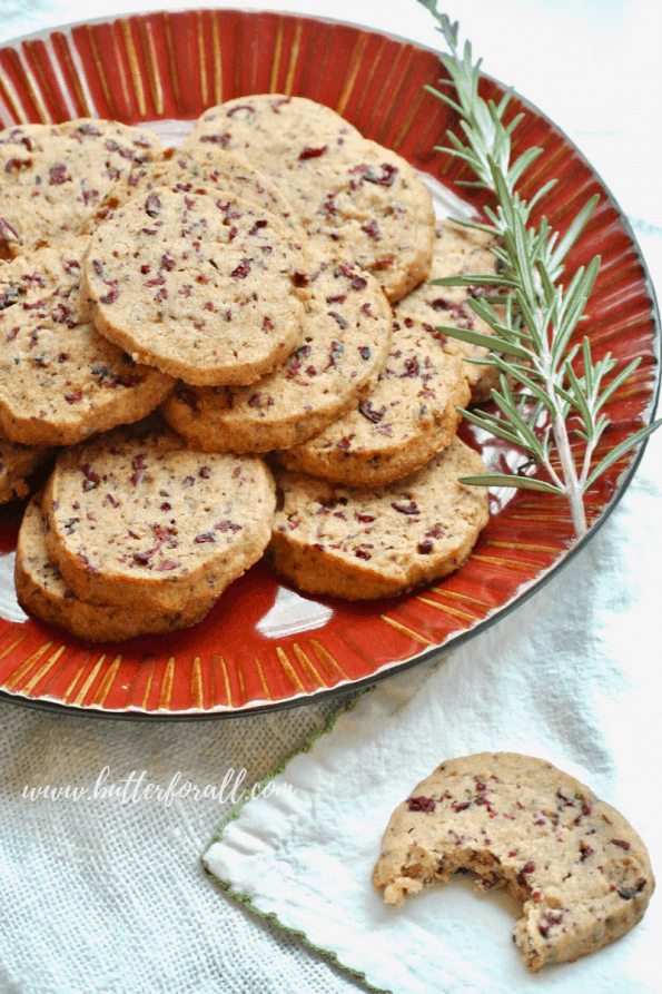 A plate of cranberry rosemary shortbread cookies.