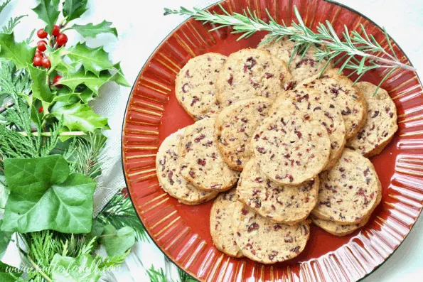 A plate of cranberry rosemary shortbread cookies.