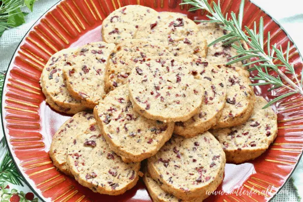 Platter showing a stack of delicious cranberry shortbread cookies.
