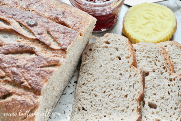 A loaf of sliced sourdough bread.