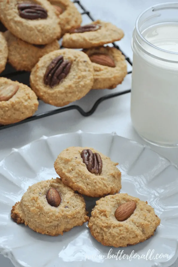 A close-up of grain-free cookies topped with nuts.