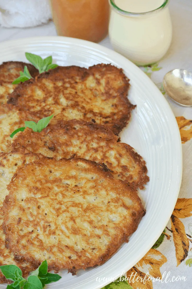 This easy 7 ingredient sourdough batter makes a perfect Sourdough Potato Pancake with a soft chewy center and crispy crunchy exterior. #Latkes #Breakfast #Brunch #Starter #fermented #sourdough #batter #pancake #potato #savory #applesauce #sourcream #cultured #realfood #wapf #nourishingtraditions #sourdoughforlife #sidedish #snack #healthy #traditional