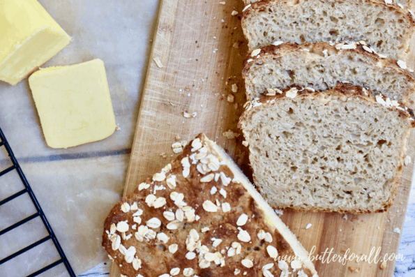 Top view of a loaf of sliced buttermilk sourdough showing the semi-open crumb.