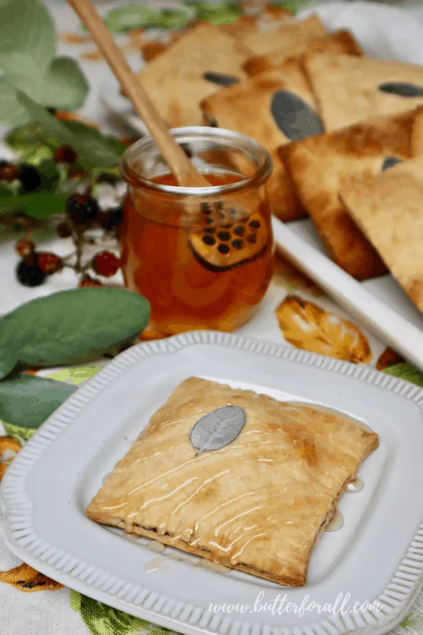 A golden-brown and flaky sourdough toaster tart drizzled with honey.